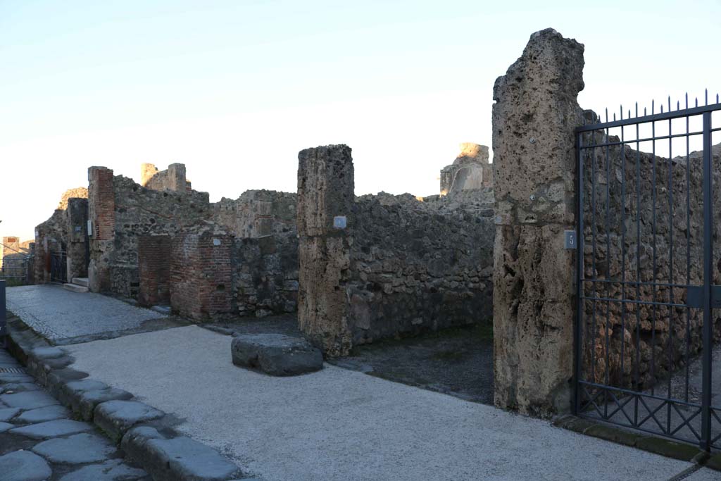 Via Marina, north side, Pompeii. December 2018. 
Looking north-west from VII.7.11, on left, to VII.7.5, on right. Photo courtesy of Aude Durand