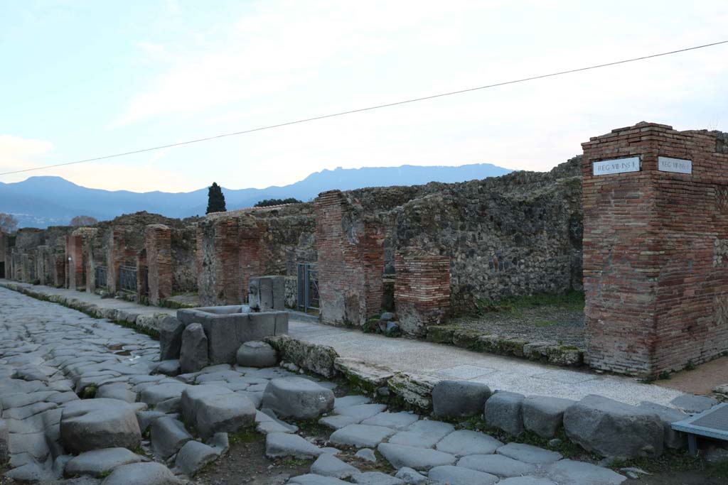 Via Stabiana, west side, Pompeii. December 2018. 
Looking south-west towards fountain outside VII.1.32. Photo courtesy of Aude Durand.