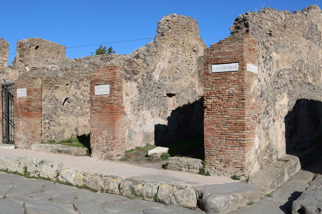 Via Stabiana, east side, Pompeii. December 2018. 
IX.2.10 and 11, on left, and IX.2.12, centre right, with the junction with Vicolo di Balbo, on right. Photo courtesy of Aude Durand.