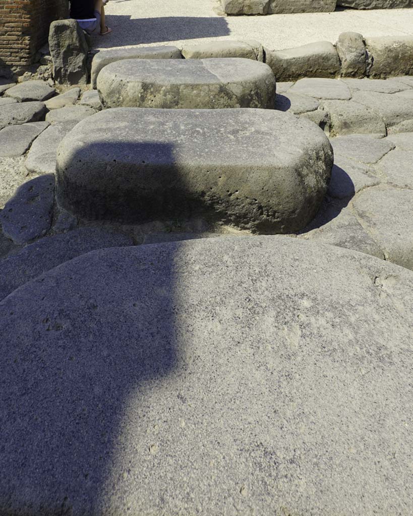 Via Stabiana, August 2021. 
Looking west across stepping stones towards corner at VII.I.13. Photo courtesy of Robert Hanson.