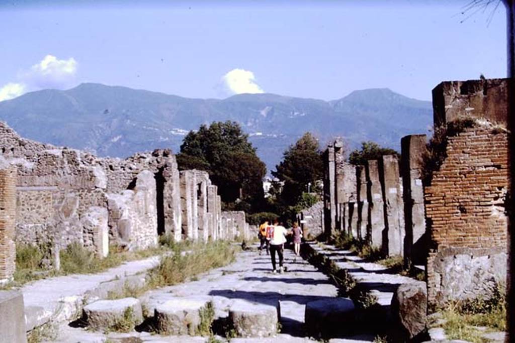 Via Stabiana, Pompeii. 1968. Looking south from Holconius crossroads between I.4 and VIII.4.  Photo by Stanley A. Jashemski.
Source: The Wilhelmina and Stanley A. Jashemski archive in the University of Maryland Library, Special Collections (See collection page) and made available under the Creative Commons Attribution-Non Commercial License v.4. See Licence and use details.
J68f0064