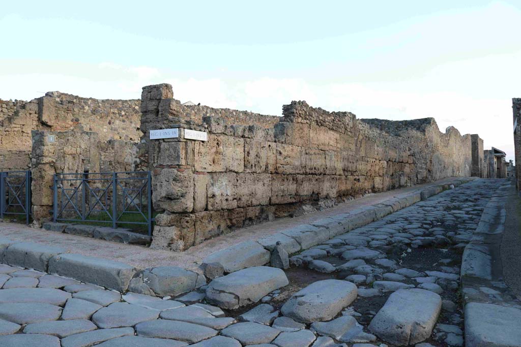 Via Stabiana at I.4.1 Pompeii, on left. December 2018. 
Looking towards doorway on north-east side of junction between Via Stabiana, on left, and Vicolo del Menandro, on right. Photo courtesy of Aude Durand.