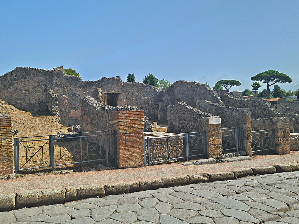 Via Stabiana, east side, Pompeii. September 2024. 
Entrance doorways from I.2.12, I.2.11, I.2.10 and I.2.9, on right. Photo courtesy of Giuseppe Ciaramella.