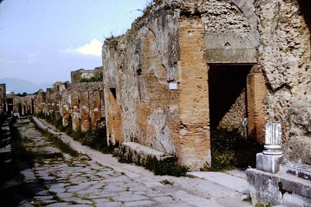 Via degli Augustali, Pompeii. 1964. Looking east.  Photo by Stanley A. Jashemski.
Source: The Wilhelmina and Stanley A. Jashemski archive in the University of Maryland Library, Special Collections (See collection page) and made available under the Creative Commons Attribution-Non Commercial License v.4. See Licence and use details.
J64f1321