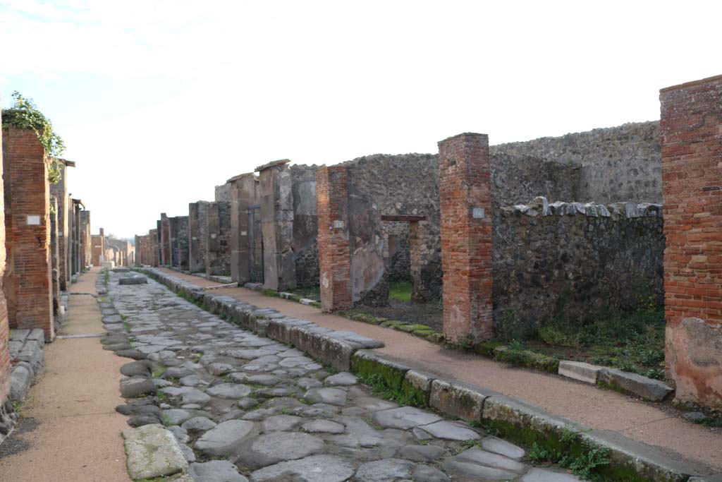 Via degli Augustali, south side, Pompeii. December 2018. 
Looking east between VII.4, on left, and VII.9.16, on right. Photo courtesy of Aude Durand.
