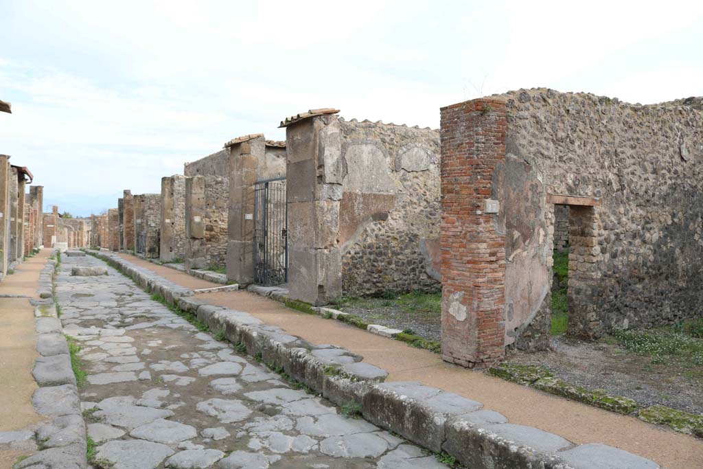 Via degli Augustali, south side, Pompeii. December 2018. 
Looking east from VII.9.17, linked to VII.9.18, on right. Photo courtesy of Aude Durand.