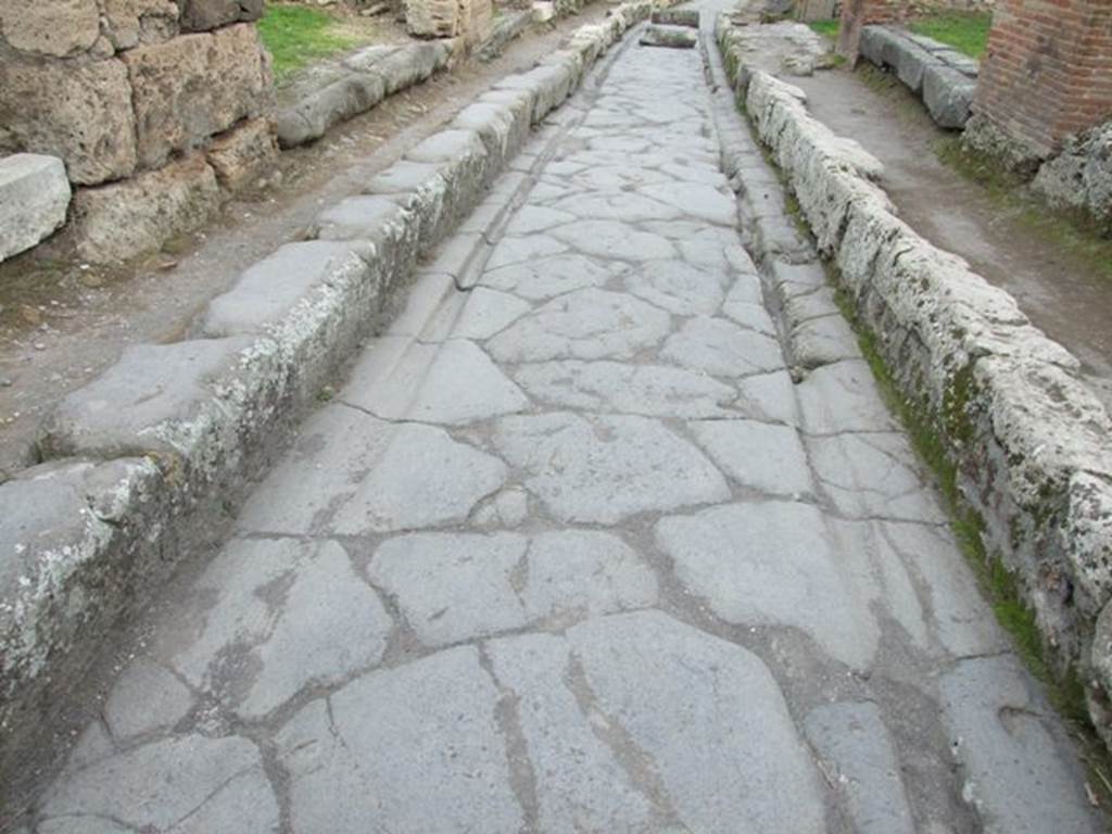 Via degli Augustali. December 2007. Looking east from VII.12.4, with wheel ruts worn by traffic.