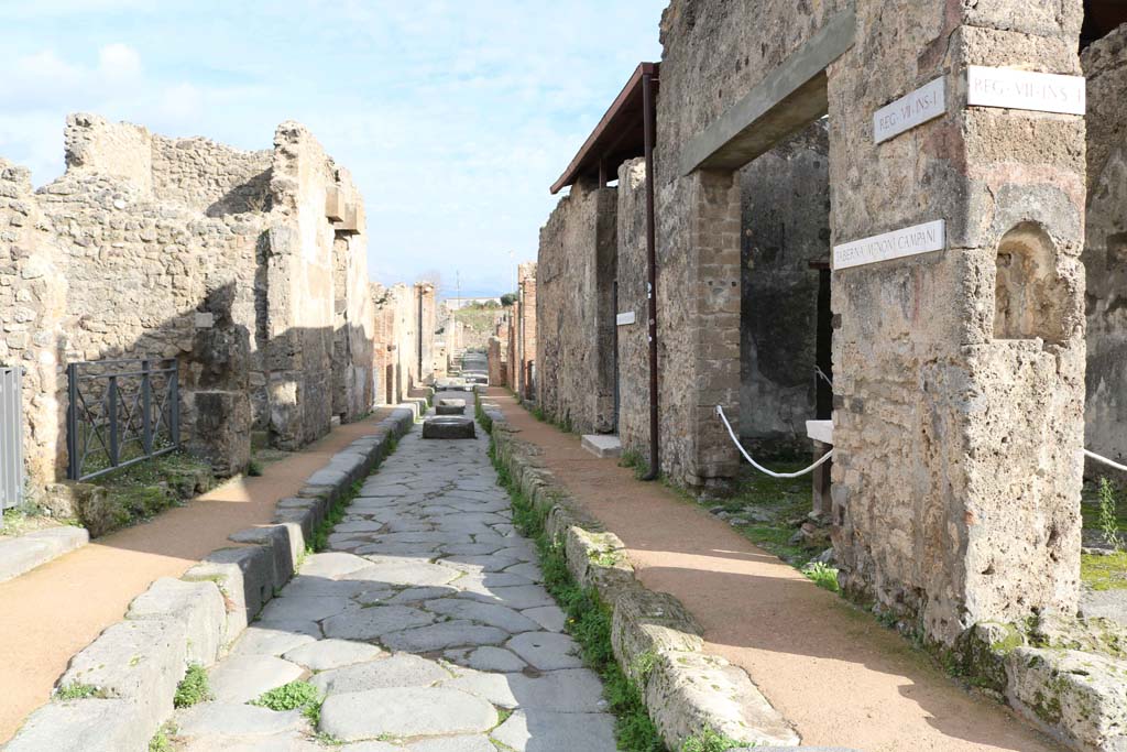 Via degli Augustali, Pompeii. December 2018. 
Looking east between VII.2, on left, and VII.1.41, on right. Photo courtesy of Aude Durand.