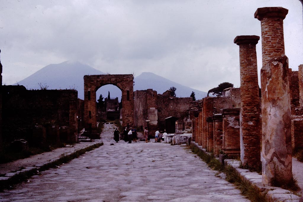 Via del Foro, Pompeii. 1964. Looking north.  Photo by Stanley A. Jashemski.
Source: The Wilhelmina and Stanley A. Jashemski archive in the University of Maryland Library, Special Collections (See collection page) and made available under the Creative Commons Attribution-Non-Commercial License v.4. See Licence and use details.
J64f1380
