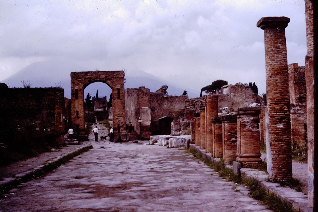 Via del Foro, Pompeii. 1964. Looking north. Photo by Stanley A. Jashemski.
Source: The Wilhelmina and Stanley A. Jashemski archive in the University of Maryland Library, Special Collections (See collection page) and made available under the Creative Commons Attribution-Non-Commercial License v.4. See Licence and use details.
J64f1001