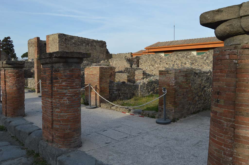 Via del Foro, east side, Pompeii. March 2019. 
Looking north-east from fourth pilaster/column, on right, towards VII.4.7, and fifth and sixth pilaster/columns. 
Foto Taylor Lauritsen, ERC Grant 681269 DÉCOR.