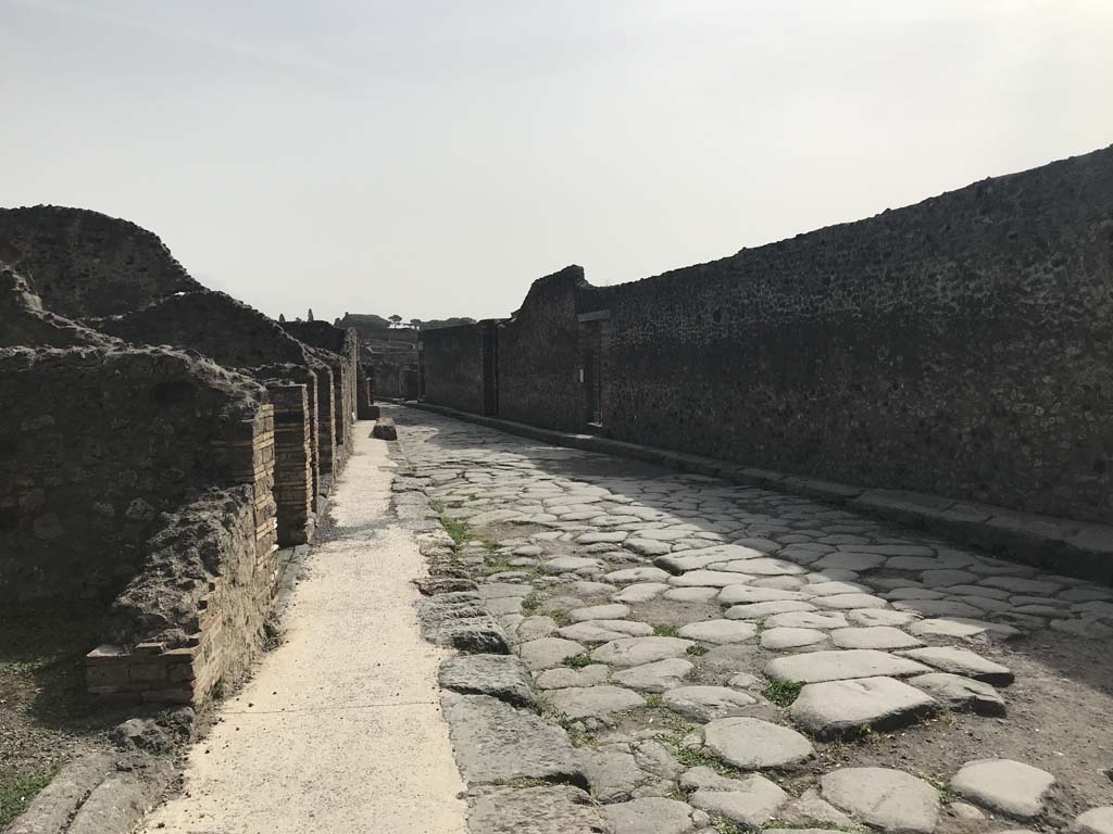 Via del Tempio d’Iside, Pompeii. April 2019. Looking east between VIII.4 and VIII.7, on right. 
Photo courtesy of Rick Bauer.
