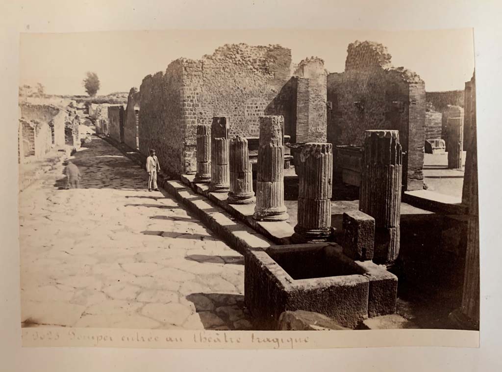 VIII.4, Pompeii, on left.    Via del Tempio d’Iside from entrance to Triangular Forum.                   VIII.7.30, on right.  
Album by M. Amodio, c.1880, entitled “Pompei, destroyed on 23 November 79, discovered in 1748”.
Looking east along Via del Tempio d’Iside. Photo courtesy of Rick Bauer.