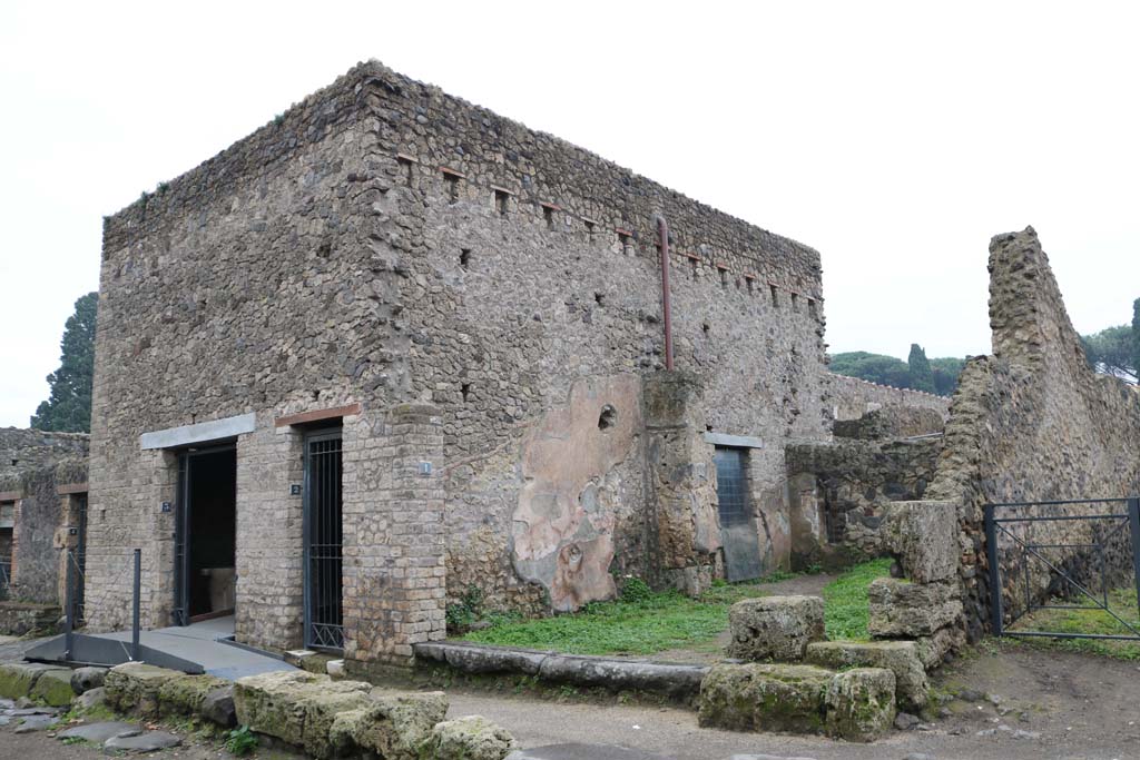 Via dell’Abbondanza, south side, Pompeii. December 2018. 
Looking south-east towards doorways II.4.3, II.4.2 and II.4.1. Photo courtesy of Aude Durand.