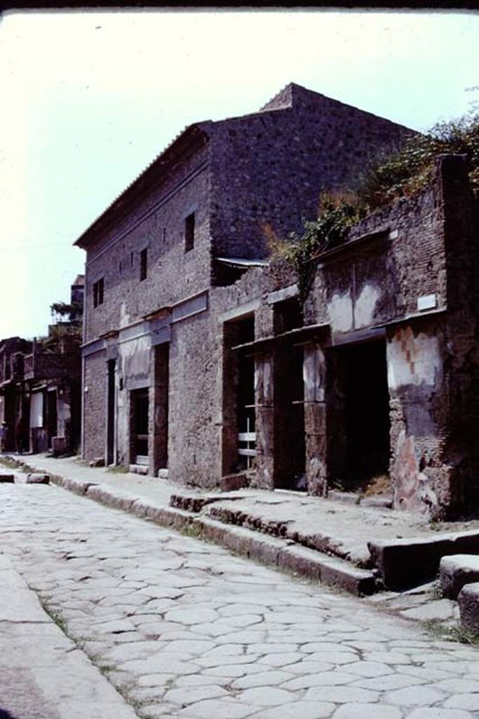 Via dell’Abbondanza, Pompeii. 1973. Looking west towards IX.13.1-6. Photo by Stanley A. Jashemski. 
Source: The Wilhelmina and Stanley A. Jashemski archive in the University of Maryland Library, Special Collections (See collection page) and made available under the Creative Commons Attribution-Non Commercial License v.4. See Licence and use details. J73f0550