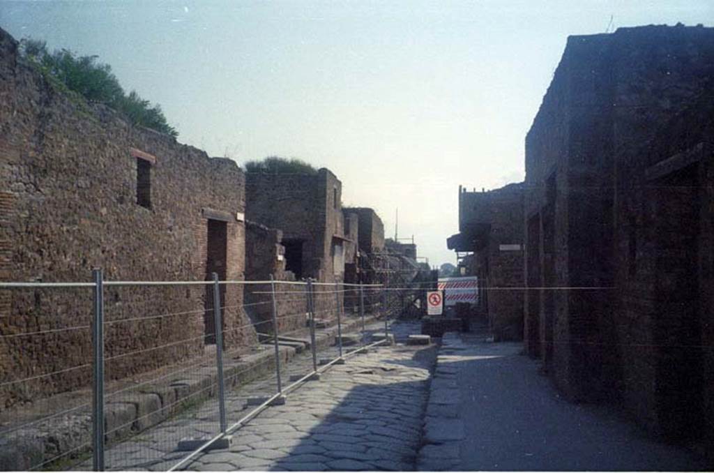 Via dell’Abbondanza, July 2011. Looking east from near III.1.6, on left, towards unnamed vicolo and III.2. Photo courtesy of Rick Bauer.