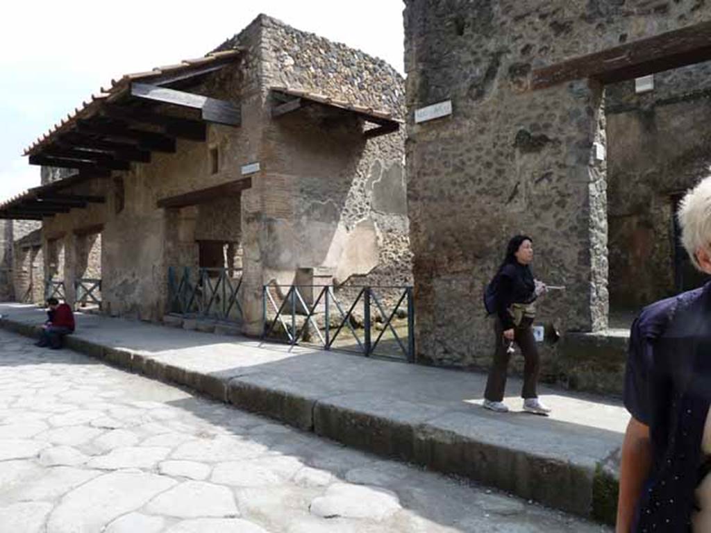 Via dell’Abbondanza, south side. May 2010. Looking east from near I.9.6, towards unnamed vicolo and I.11.
