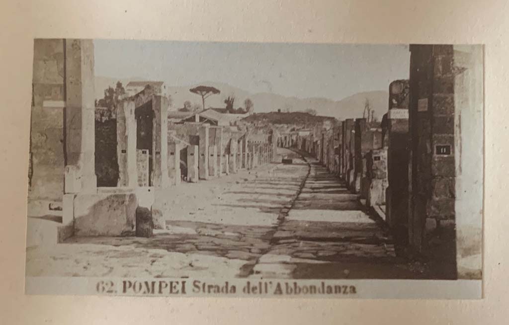 Via dell’ Abbondanza, Pompeii. From an album dated 1882. Looking east between VII.9 and VIII.3.
Photo courtesy of Rick Bauer.
