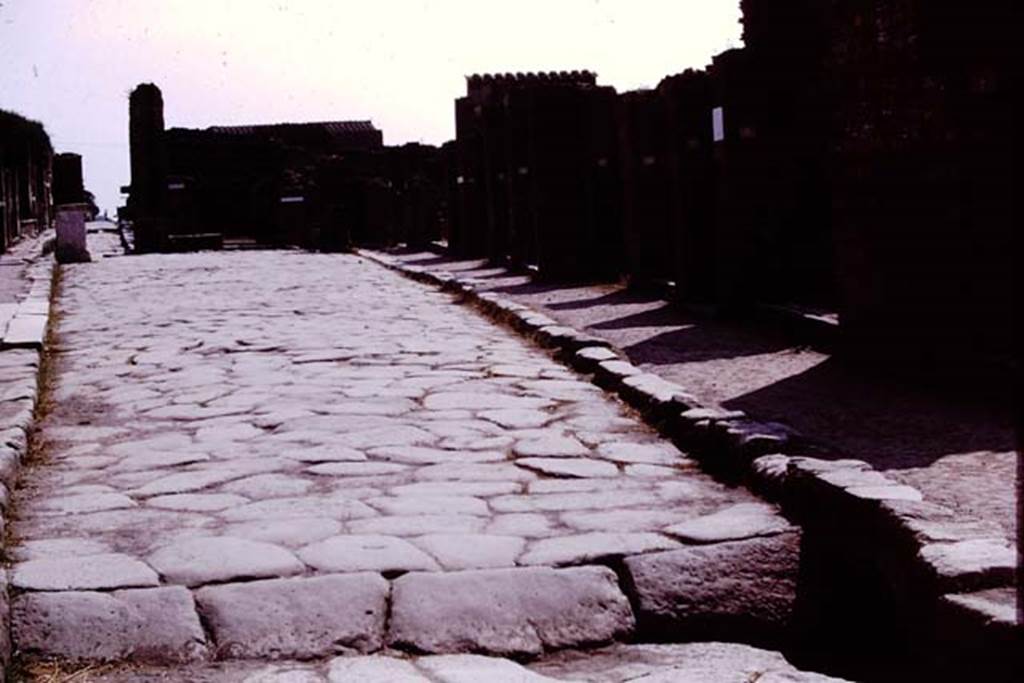 Via dell’Abbondanza, Pompeii. 1975. Looking east. Photo by Stanley A. Jashemski.   
Source: The Wilhelmina and Stanley A. Jashemski archive in the University of Maryland Library, Special Collections (See collection page) and made available under the Creative Commons Attribution-Non Commercial License v.4. See Licence and use details. J75f0375
