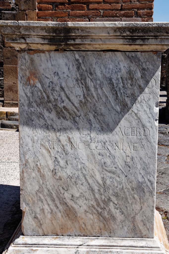 Via dell’Abbondanza, north side. April 2021. 
Statue base of Holconius Rufus near VII.1.11. Photo courtesy of Nicolas Monteix.