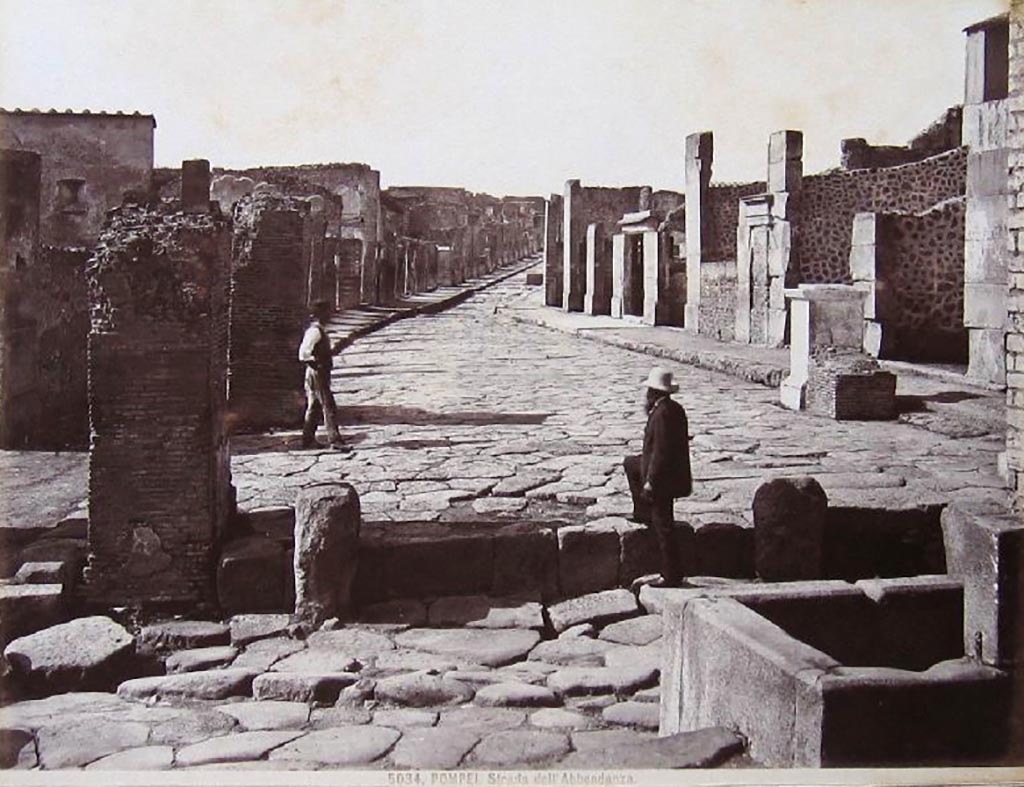 Via dell’Abbondanza, Pompeii. 
Looking west from Holconius’ crossroads, with VIII.4, on left, and VII.1, on right.
Photograph No. 5034, by Giacomo Brogi (1822-1881).  Public domain, via Wikimedia Commons