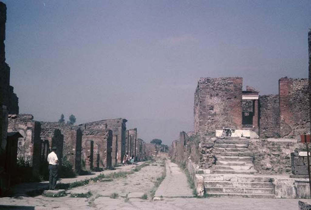 Via della Fortuna, Pompeii. August 1965. Looking east from crossroads and Temple of Fortuna Augusta (right). Photo courtesy of Rick Bauer.