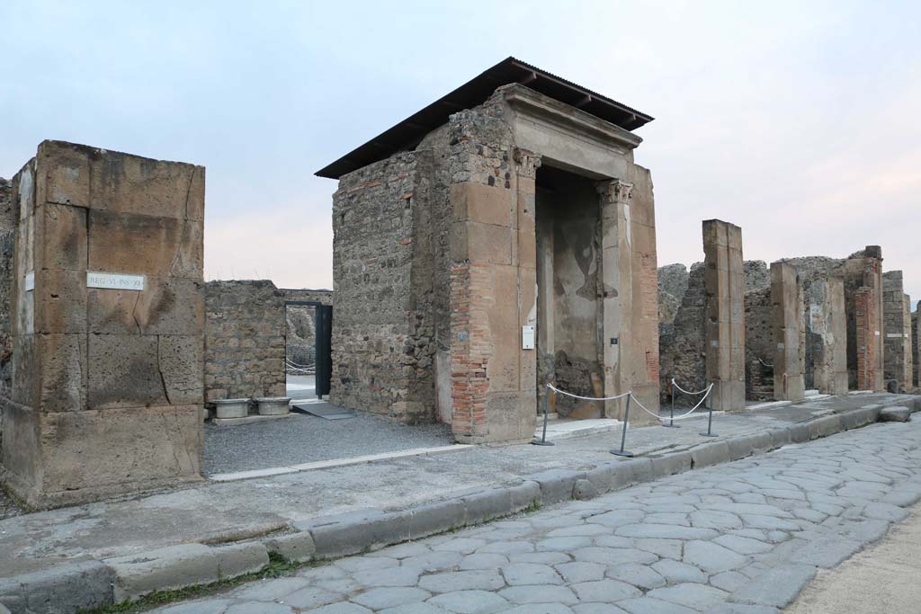 Via della Fortuna, north side. December 2018. 
Looking north-east towards entrance doorways with VI.12.1, on left towards VI.12.6, on right.
Photo courtesy of Aude Durand.
