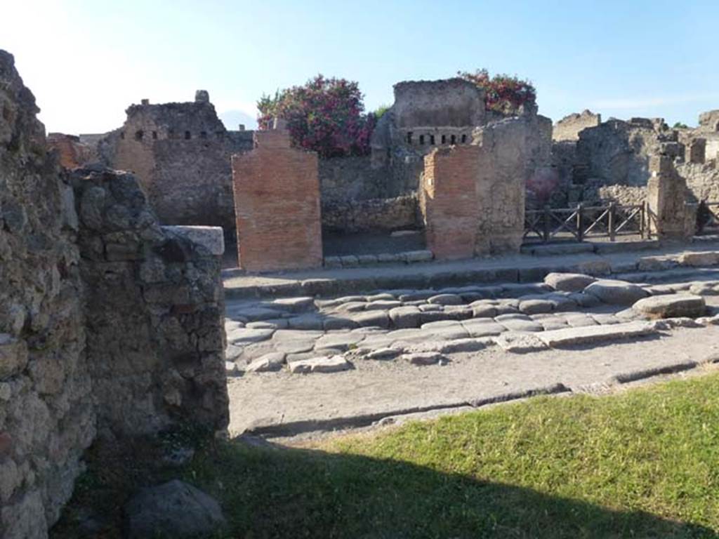 Via della Fortuna. June 2012. Looking north across wheel ruts from VII.3, towards VI.14. Photo courtesy of Michael Binns.