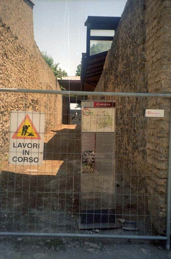 Via della Palestra between II.9 and II.8. July 2011. 
Looking east, road closed while work is in progress. Photo courtesy of Rick Bauer.