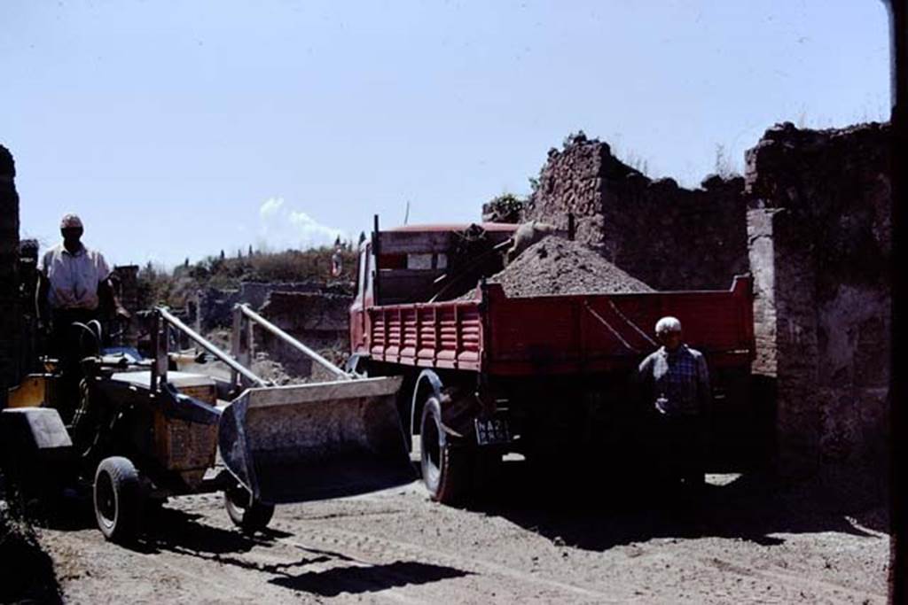 Via della Palestra. Pompeii. 1972. Looking west at junction with Vicolo della Nave Europa during removal of lapilli. Photo by Stanley A. Jashemski. 
Source: The Wilhelmina and Stanley A. Jashemski archive in the University of Maryland Library, Special Collections (See collection page) and made available under the Creative Commons Attribution-Non Commercial License v.4. See Licence and use details. J72f0705