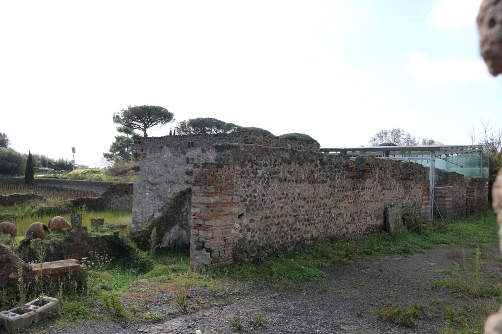 Via della Palestra, Pompeii. December 2018. 
Looking south-west from I.22.3, on left, towardsI.22.1, on right. Photo courtesy of Aude Durand.