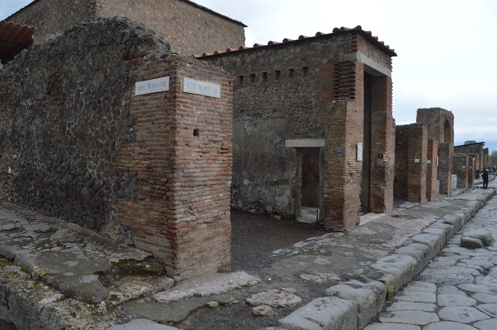 Via delle Terme, north side. March 2018. 
Looking north-east from junction with Vicolo della Fullonica along Insula VI.8, from VI.8.4/5, in centre.  
Foto Taylor Lauritsen, ERC Grant 681269 DÉCOR