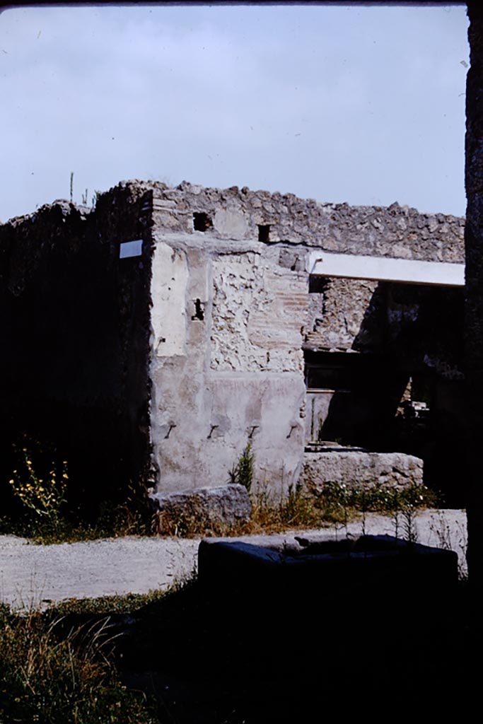 Via di Castricio, north side, Pompeii. 1964. Looking north towards I.11.11, from fountain at I.16.4   
Below the site of the sign of the Phoenix, CIL IV 9851 can still be read. Photo by Stanley A. Jashemski.
Source: The Wilhelmina and Stanley A. Jashemski archive in the University of Maryland Library, Special Collections (See collection page) and made available under the Creative Commons Attribution-Non-Commercial License v.4. See Licence and use details.
J64f1492