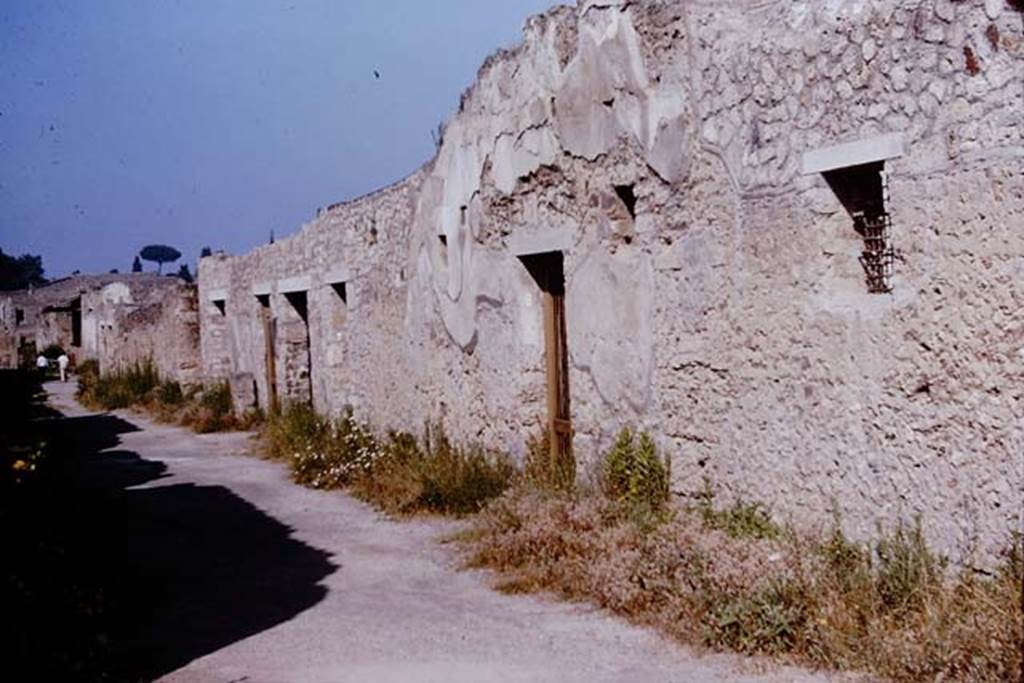 Via di Castricio, Pompeii. 1964. Looking west along 1.12, on the north side between 1.15 and I.12. Photo by Stanley A. Jashemski. 
Source: The Wilhelmina and Stanley A. Jashemski archive in the University of Maryland Library, Special Collections (See collection page) and made available under the Creative Commons Attribution-Non Commercial License v.4. See Licence and use details.
J64f1845