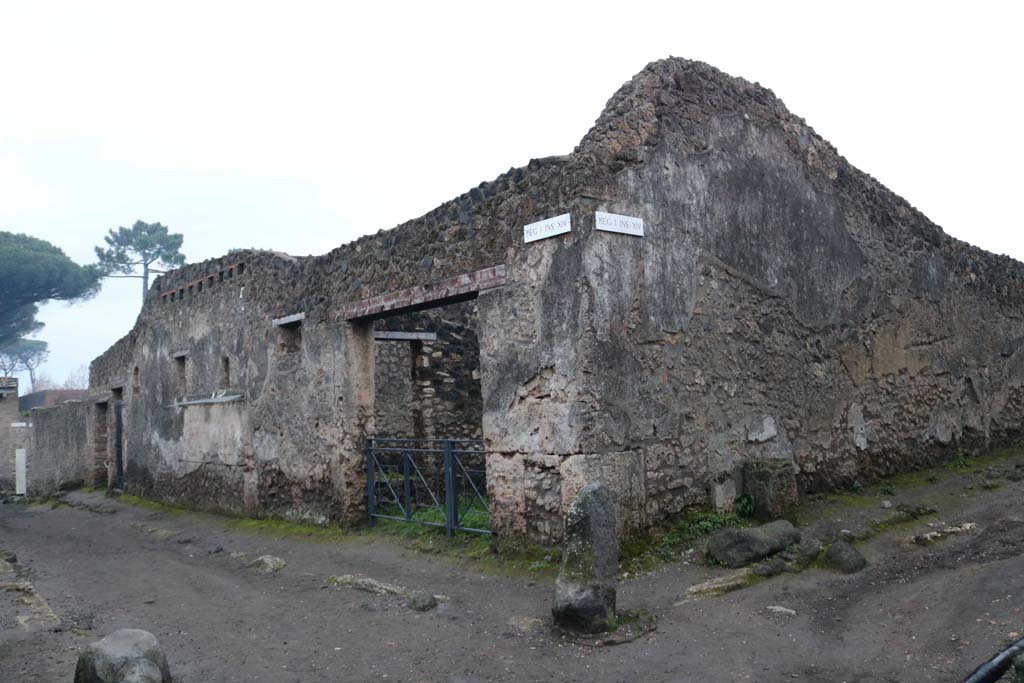 Via di Castricio, south side. December 2018. 
Looking east between I.14.6/7 and I.14.8, in centre. with Vicolo dei Fuggiaschi, on right.  Photo courtesy of Aude Durand.