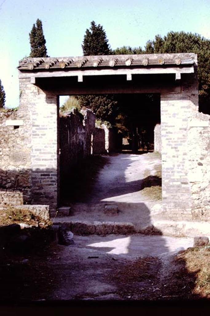 Via di Castricio between II.1 and II.9, Pompeii. 1972.  Looking east from junction with Via di Nocera.  Photo by Stanley A. Jashemski. 
Source: The Wilhelmina and Stanley A. Jashemski archive in the University of Maryland Library, Special Collections (See collection page) and made available under the Creative Commons Attribution-Non Commercial License v.4. See Licence and use details. J72f0503