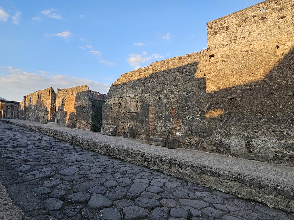 Via di Mercurio, east side, Pompeii. November 2024. 
Looking north towards doorway at VI.10.8, in centre. Photo courtesy of Annette Haug.