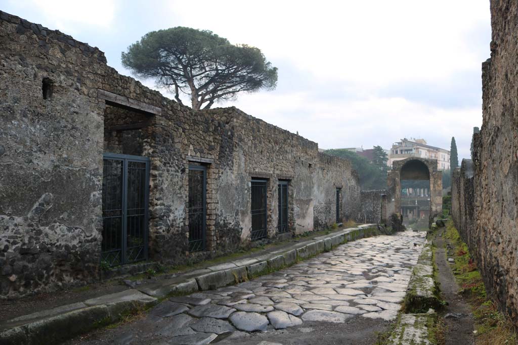 Via di Nocera, east side, Pompeii, December 2018. 
Looking south from near II.8.5, on left, towards Porta di Nocera, with I.20, on right. Photo courtesy of Aude Durand.