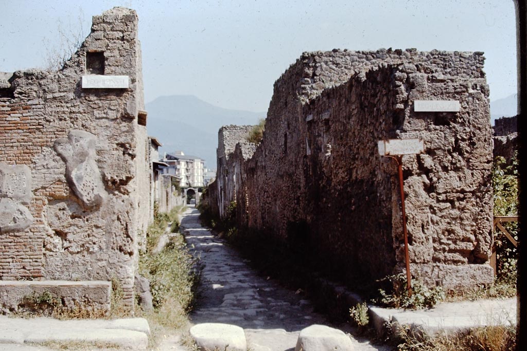 Via di Nocera, Pompeii. 1968. 
Looking south between II.1 and I.13, from junction with Via dell’Abbondanza. Photo by Stanley A. Jashemski.
Source: The Wilhelmina and Stanley A. Jashemski archive in the University of Maryland Library, Special Collections (See collection page) and made available under the Creative Commons Attribution-Non Commercial License v.4. See Licence and use details.
J68f0351