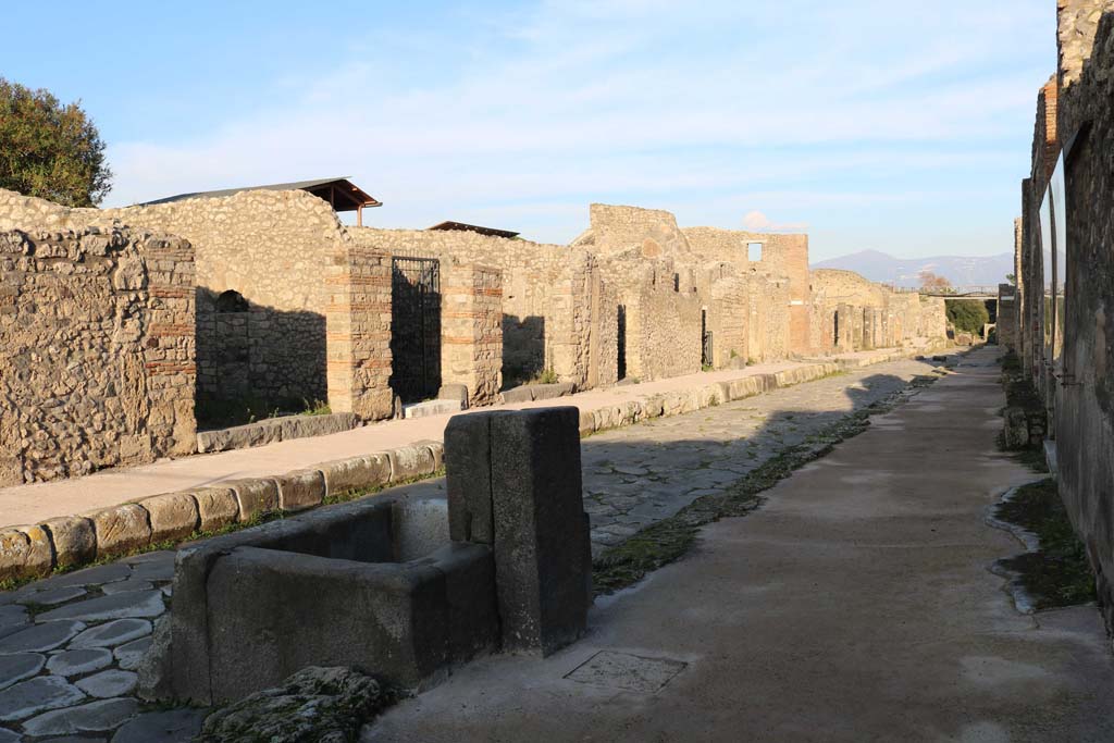 Via di Nola, north side, December 2018. 
Looking north-east along insula V.3 and V.4, from near fountain at IX.8.1. Photo courtesy of Aude Durand.