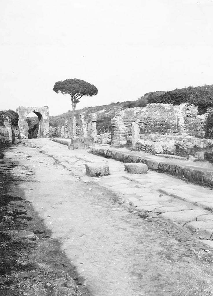 Via di Nola, Pompeii. 1933. 
Looking east towards the Nola Gate, and fountain on south side near III.11. Photo courtesy of Peter Woods.