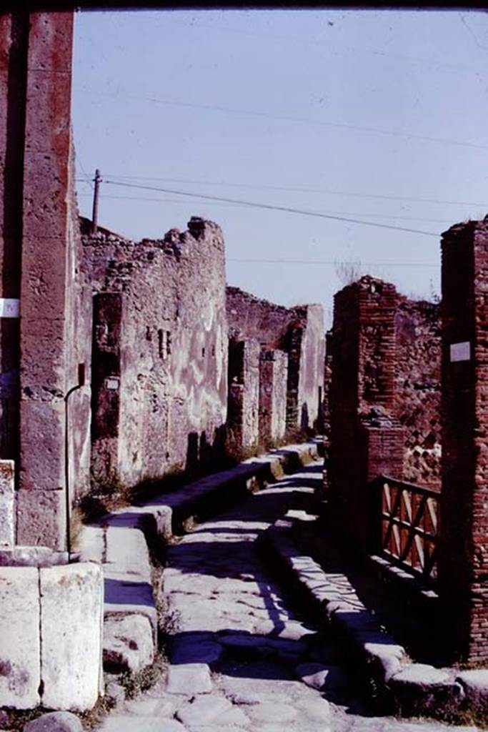 Vicolo Storto, Pompeii, 1978. Looking north from junction. Photo by Stanley A. Jashemski.   
Source: The Wilhelmina and Stanley A. Jashemski archive in the University of Maryland Library, Special Collections (See collection page) and made available under the Creative Commons Attribution-Non Commercial License v.4. See Licence and use details. J78f0570