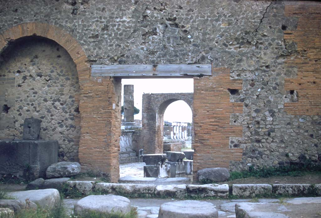 Vicolo dei Soprastanti, south side, Pompeii. November 1958. Looking south through entrance to Forum at VII.7.26. 
Photo courtesy of Rick Bauer.