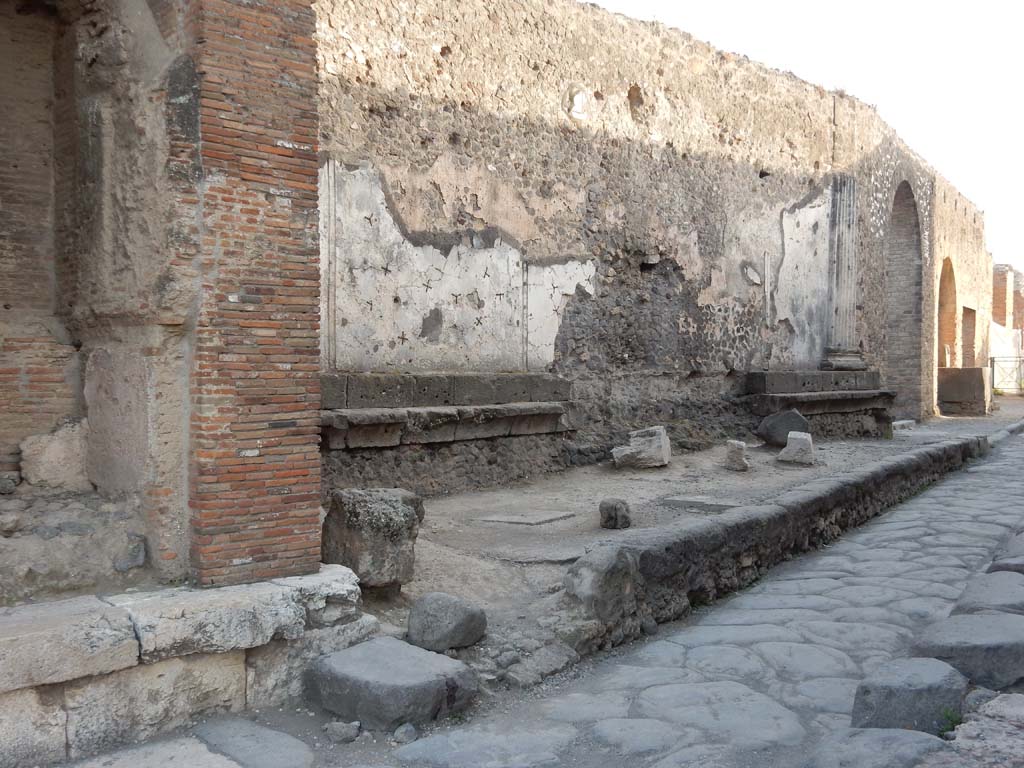 Vicolo dei Soprastanti, Pompeii. June 2019. Looking west from arch, (on left) along north wall of Forum. 
Photo courtesy of Buzz Ferebee.