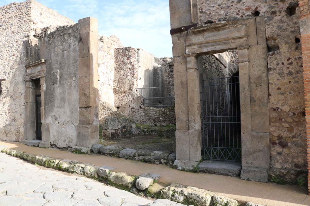 Vicolo del Lupanare, east side, Pompeii. December 2018. 
Looking towards entrances at VII.1.48, on left, VII.1.49, in centre, with VII.1.50, on right. Photo courtesy of Aude Durand.