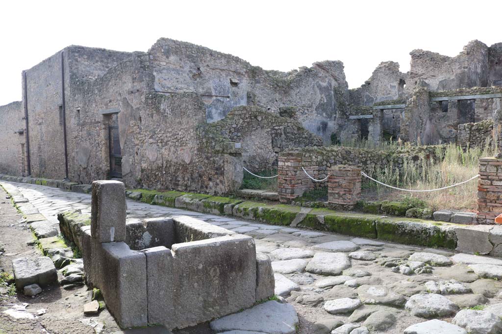 Looking south-west along Vicolo della Maschera. December 2018. 
From left to right are the entrances to VII.10.13, VII.10.12, VII.10.11 and VII.10.10.  Photo courtesy of Aude Durand.