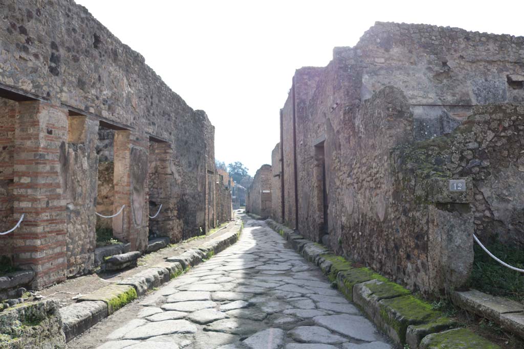 Vicolo della Maschera, Pompeii. December 2018. 
Looking south between VII.11, on left, and VII.10.12, on right. Photo courtesy of Aude Durand.