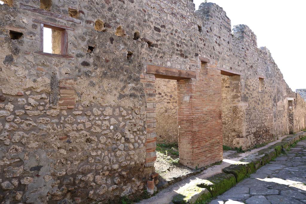 Vicolo di Balbo, south side, Pompeii. December 2018. 
Looking west towards entrance doorways with IX.1.31 Pompeii, on left. Photo courtesy of Aude Durand