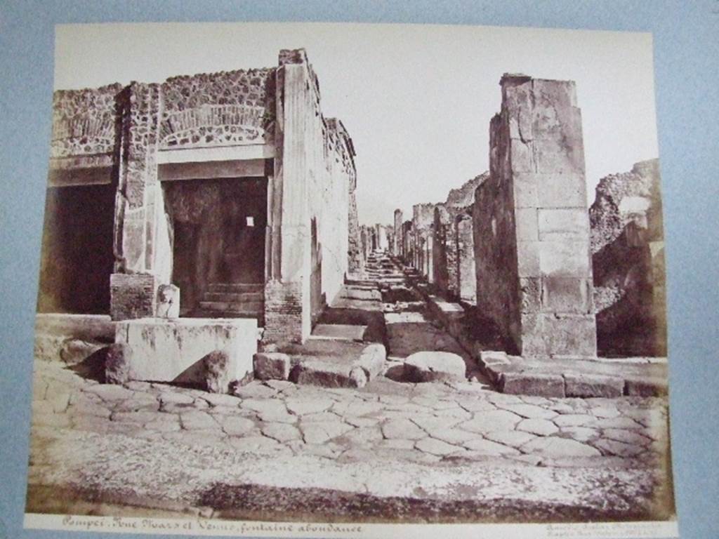 Vicolo di Eumachia between VII.9 and VII.13. Looking north from junction with Via dell’Abbondanza. Old undated photograph courtesy of the Society of Antiquaries, Fox Collection.