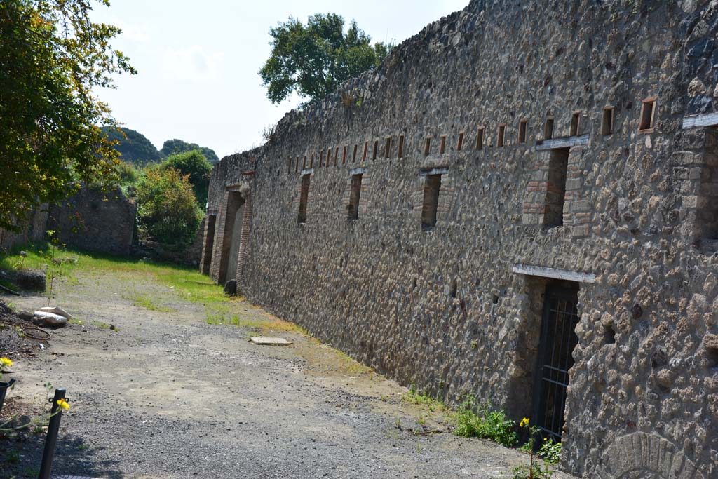 Vicolo di Paquius Proculus. April 2017. Looking south towards doorways to I.10.15 (on right), I.10.14, and I.10.13 (centre left). 
Photo courtesy Adrian Hielscher.